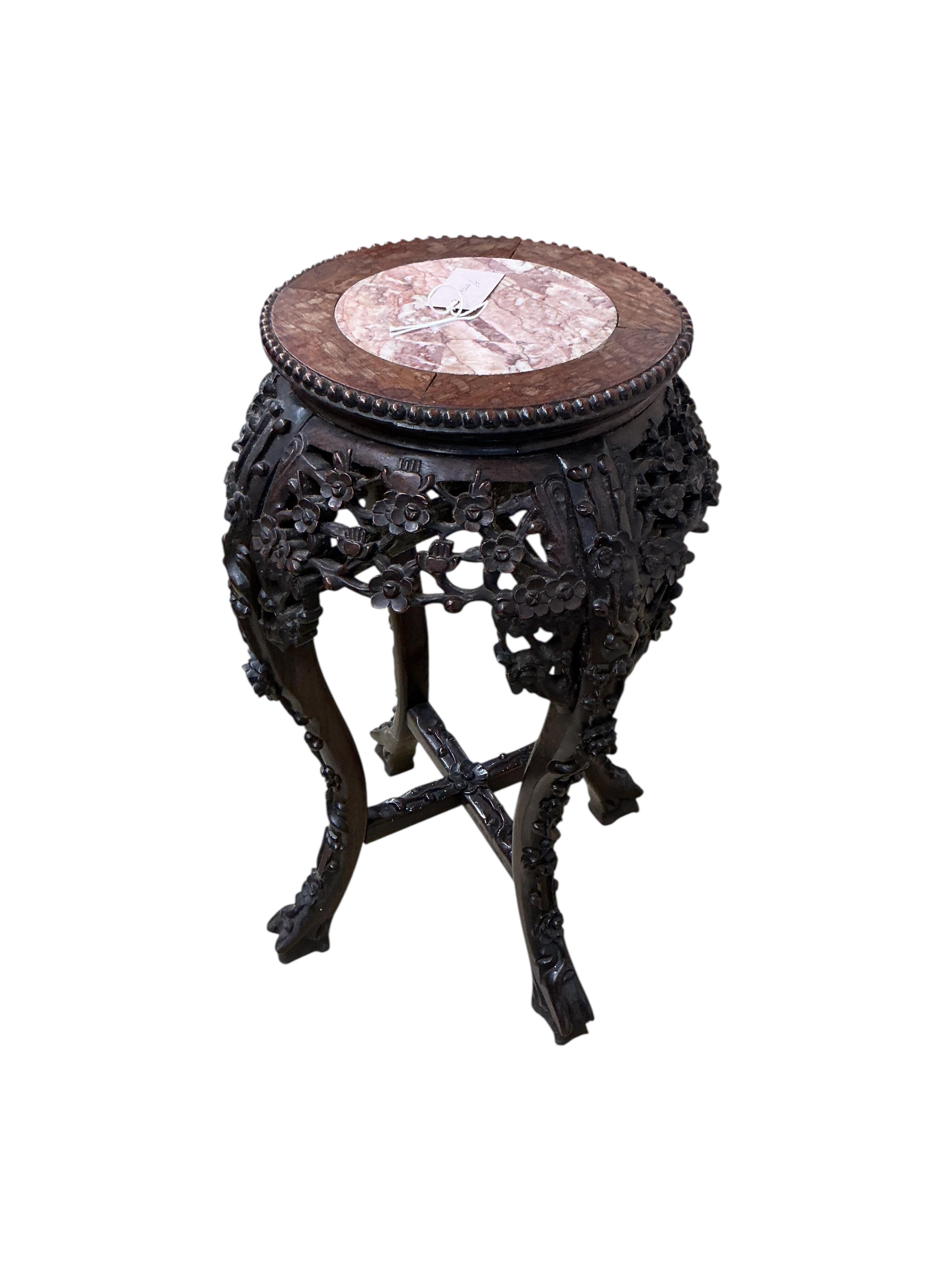 A Chinese carved padouk rouge marble topped jardiniere stand, height 60cm